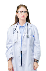 Sticker - Middle age mature doctor woman wearing medical coat over isolated background puffing cheeks with funny face. Mouth inflated with air, crazy expression.