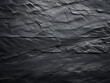 Slate-textured backdrop with dark grey-black tones