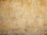 Fototapeta  - Close-up of a plastered wall reveals a fine, grungy texture with golden hues