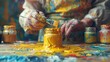 Painter at work, brush in hand, gouache jars, canvas, palette, background
