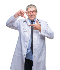 Sticker - Handsome senior doctor man over isolated background smiling making frame with hands and fingers with happy face. Creativity and photography concept.