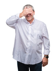 Sticker - Handsome senior man over isolated background smiling and laughing with hand on face covering eyes for surprise. Blind concept.