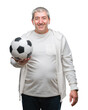 Handsome senior man holding soccer football ball over isolated background with a happy face standing and smiling with a confident smile showing teeth
