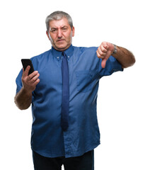 Sticker - Handsome senior man texting sending message using smartphone over isolated background with angry face, negative sign showing dislike with thumbs down, rejection concept