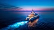 © Suleyman - Picture of a big white boat at night on the ocean. Lights from the boat shine on the water, making it look colorful. The sky is dark blue, and the horizon is in the distance.