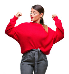 Sticker - Young beautiful business woman wearing winter sweater over isolated background showing arms muscles smiling proud. Fitness concept.