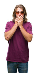 Poster - Young handsome man with long hair wearing sunglasses over isolated background shocked covering mouth with hands for mistake. Secret concept.