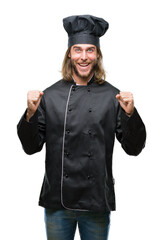 Canvas Print - Young handsome cook man with long hair over isolated background celebrating surprised and amazed for success with arms raised and open eyes. Winner concept.