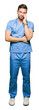 © Krakenimages.com - Handsome doctor man wearing medical uniform over isolated background thinking looking tired and bored with depression problems with crossed arms.