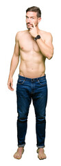 Canvas Print - Handsome shirtless man showing nude chest Pointing to the eye watching you gesture, suspicious expression