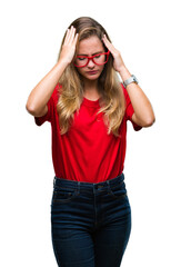 Sticker - Young beautiful blonde woman wearing glasses over isolated background suffering from headache desperate and stressed because pain and migraine. Hands on head.