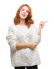 Poster - Young beautiful woman over isolated background wearing winter sweater with a big smile on face, pointing with hand and finger to the side looking at the camera.