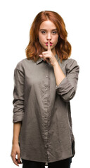 Poster - Young beautiful woman over isolated background asking to be quiet with finger on lips. Silence and secret concept.