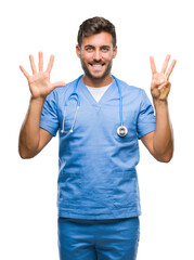 Canvas Print - Young handsome doctor surgeon man over isolated background showing and pointing up with fingers number eight while smiling confident and happy.