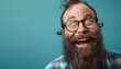 Quirky Man with Thick Beard and Glasses Laughing Joyously on a Teal Background
