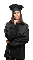 Sticker - Young hispanic cook woman wearing chef uniform serious face thinking about question, very confused idea