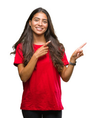 Wall Mural - Young beautiful arab woman over isolated background smiling and looking at the camera pointing with two hands and fingers to the side.
