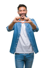 Sticker - Adult hispanic man over isolated background smiling in love showing heart symbol and shape with hands. Romantic concept.