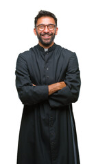 Wall Mural - Adult hispanic catholic priest man over isolated background happy face smiling with crossed arms looking at the camera. Positive person.