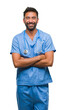 © Krakenimages.com - Adult hispanic doctor or surgeon man over isolated background happy face smiling with crossed arms looking at the camera. Positive person.
