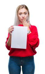 Sticker - Young blonde woman holding blank paper sheet over isolated background cover mouth with hand shocked with shame for mistake, expression of fear, scared in silence, secret concept