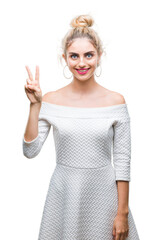 Sticker - Young beautiful blonde and blue eyes woman over isolated background showing and pointing up with fingers number two while smiling confident and happy.