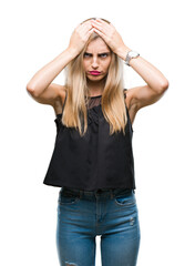 Sticker - Young beautiful blonde and blue eyes woman over isolated background suffering from headache desperate and stressed because pain and migraine. Hands on head.