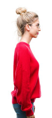 Canvas Print - Young beautiful blonde woman wearing red sweater and glasses over isolated background looking to side, relax profile pose with natural face with confident smile.