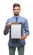 © Krakenimages.com - Young handsome business man holding clipboard over isolated background with a confident expression on smart face thinking serious