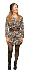 Poster - Beautiful middle age woman wearing leopard animal print dress looking away to side with smile on face, natural expression. Laughing confident.