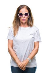 Wall Mural - middle age hispanic woman wearing fashion sunglasses over isolated background with serious expressio