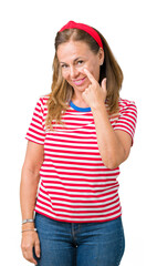 Wall Mural - beautiful middle age woman wearing casual stripes t-shirt over isolated background pointing to the e