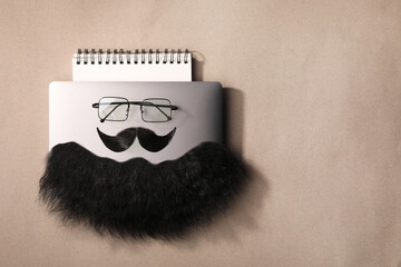 Wall Mural - Flat lay composition with artificial moustache and glasses on light brown background, space for text