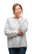 © Krakenimages.com - Middle age senior hispanic woman wearing winter sweater over isolated background with hand on chin thinking about question, pensive expression. Smiling with thoughtful face. Doubt concept.