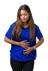 Wall Mural - Young beautiful brunette woman wearing blue t-shirt over isolated background with hand on stomach because indigestion, painful illness feeling unwell. Ache concept.