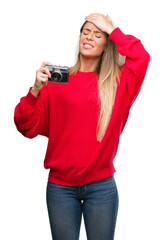 Sticker - Beautiful young woman holding vintage camera stressed with hand on head, shocked with shame and surprise face, angry and frustrated. Fear and upset for mistake.