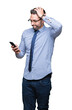 © Krakenimages.com - Young business man using smartphone over isolated background stressed with hand on head, shocked with shame and surprise face, angry and frustrated. Fear and upset for mistake.