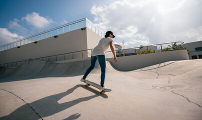 Wall Mural - Skateboarder skateboarding at skatepark in city