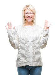 Poster - Young beautiful blonde woman wearing winter sweater and glasses over isolated background showing and pointing up with fingers number nine while smiling confident and happy.