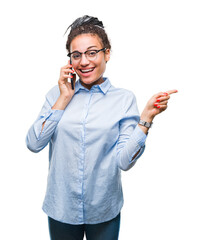 Poster - Young braided hair african american business girl showing calling using smartphone over isolated background very happy pointing with hand and finger to the side