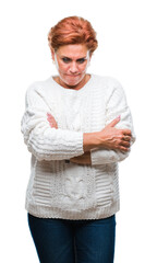 Sticker - Atrractive senior caucasian redhead woman wearing winter sweater over isolated background skeptic and nervous, disapproving expression on face with crossed arms. Negative person.