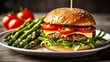  Deliciously stacked burger with fresh toppings and a side of vibrant asparagus and tomatoes