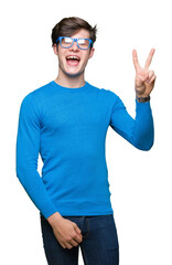 Sticker - Young handsome man wearing blue glasses over isolated background smiling with happy face winking at the camera doing victory sign. Number two.