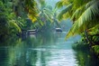 A quiet backwater in the Kerala canal network. Palm-fringed waterways meander through lush green landscapes, while traditional houseboats glide serenely through calm waters.