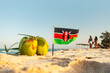 flag of Kenya on a beautiful clean white sand beach. The concept of recreation in the Kenyan Republic.