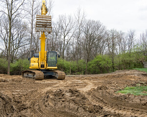 Wall Mural - Excavator Bucket Lowering to Scoop Dirt