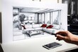 The hand is drawing a living room design project . Living room interior design sketch