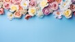 composition of flowers. Roses against a blue backdrop. Mothers' Day, Women's Day, and Valentine's Day concepts. Top view, copy space, and flat lay .