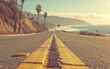 coastal highway leading directly to the sea - holiday road-trip promotion, travel vacation.