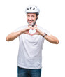 © Krakenimages.com - Middle age senior hoary cyclist man wearing bike safety helment isolated background smiling in love showing heart symbol and shape with hands. Romantic concept.